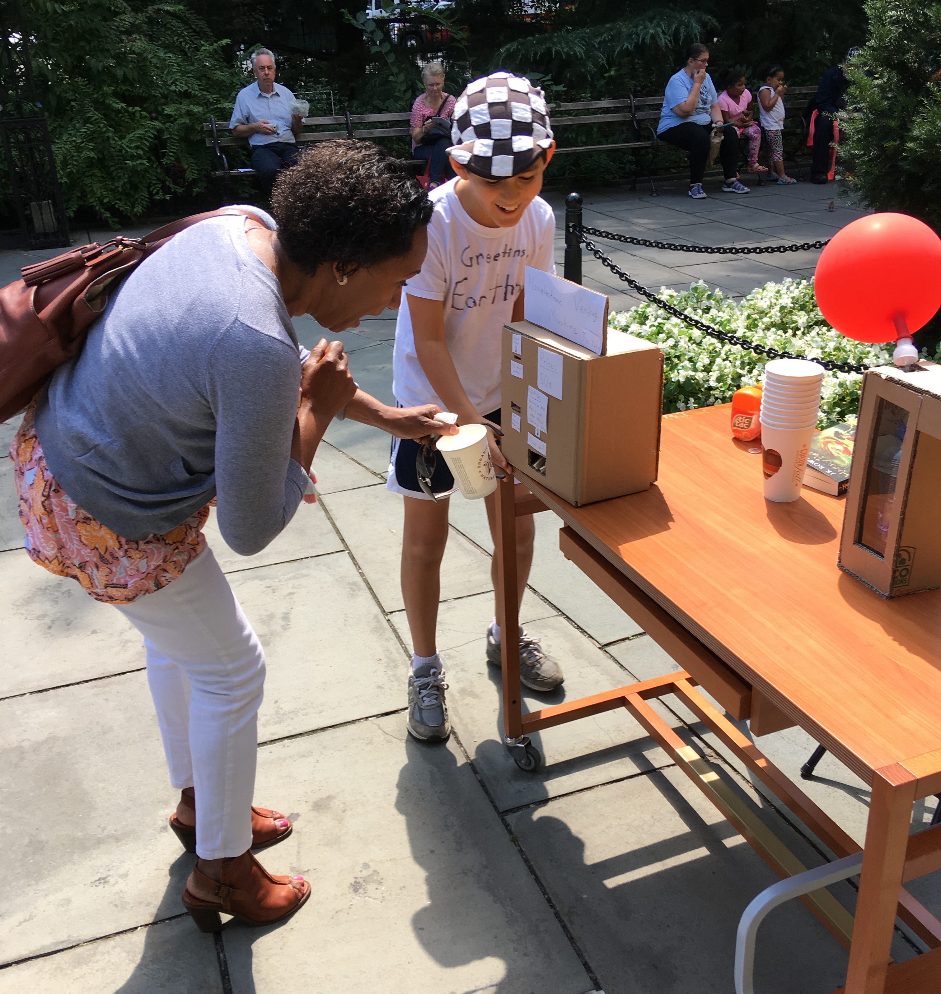 Customer interacting with stand